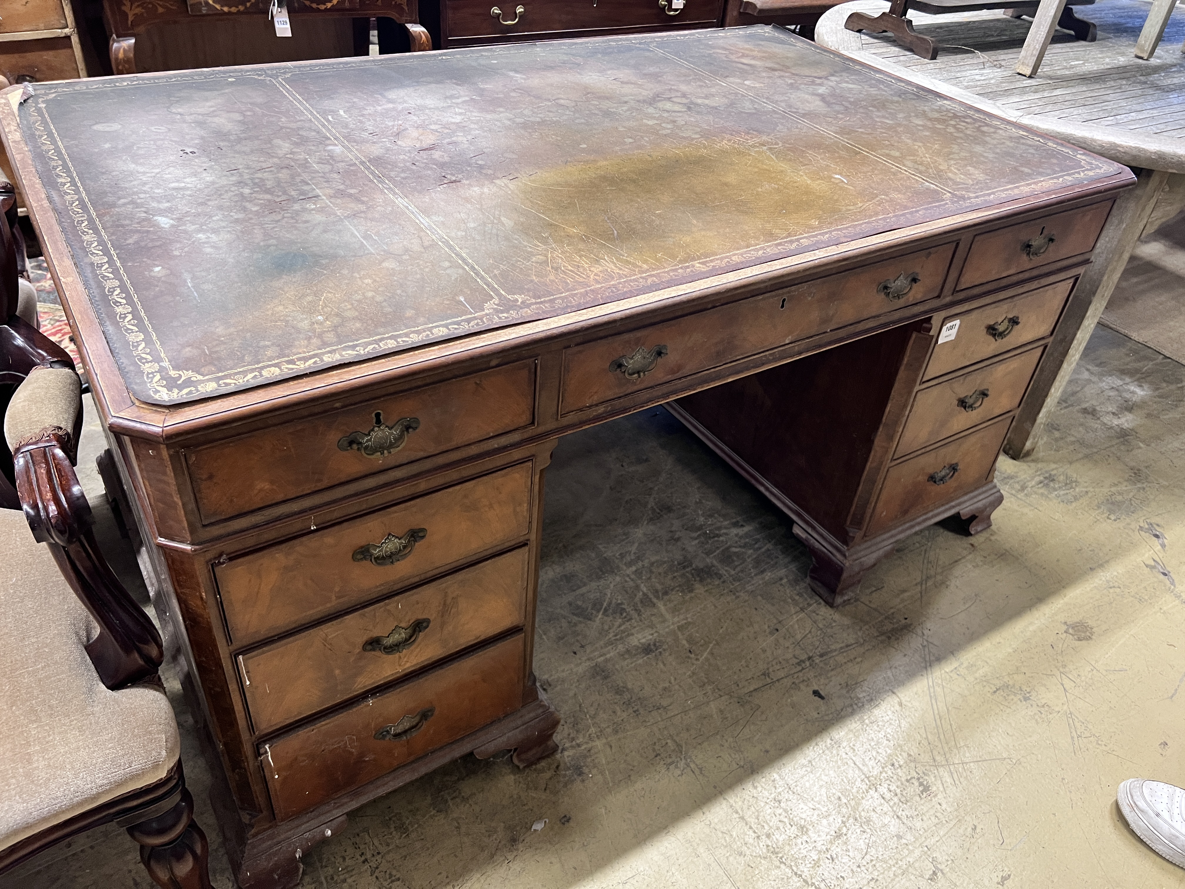 A walnut pedestal desk, width 153cm, height 91cm